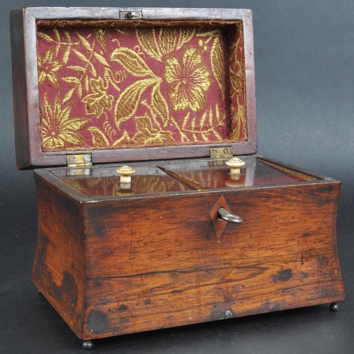 181 - An early 19th Century Regency mahogany tea caddy of sarcophagus form. Beaded decoration to lid with ... 