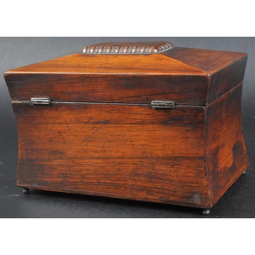 181 - An early 19th Century Regency mahogany tea caddy of sarcophagus form. Beaded decoration to lid with ... 