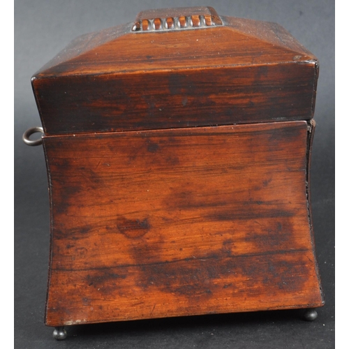 181 - An early 19th Century Regency mahogany tea caddy of sarcophagus form. Beaded decoration to lid with ... 