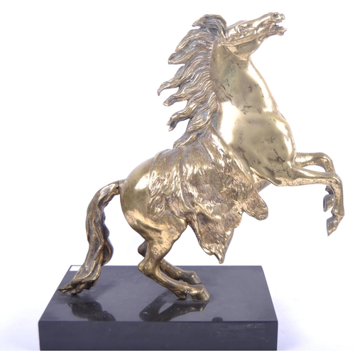 185 - A large bronze figurine depicting a Marley horse. Detailed features and modelled with front legs rai... 