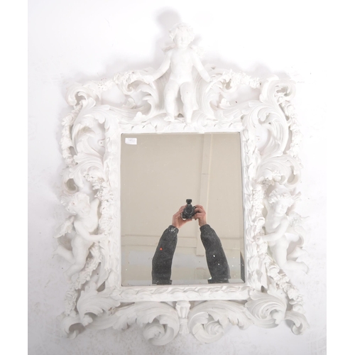 187 - A Baroque revival white painted plaster console table and matching mirror. Large angel cherub putti ... 