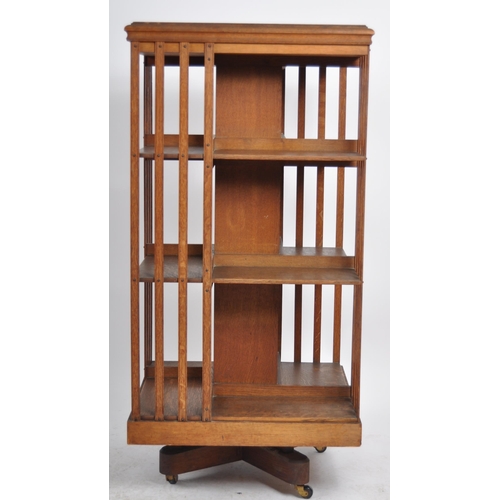 196 - An early 20th Century Edwardian oak revolving library bookcase cabinet of large size. Three tiers wi... 