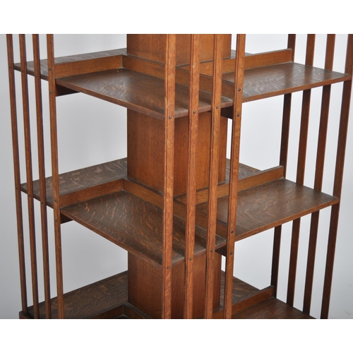 196 - An early 20th Century Edwardian oak revolving library bookcase cabinet of large size. Three tiers wi... 