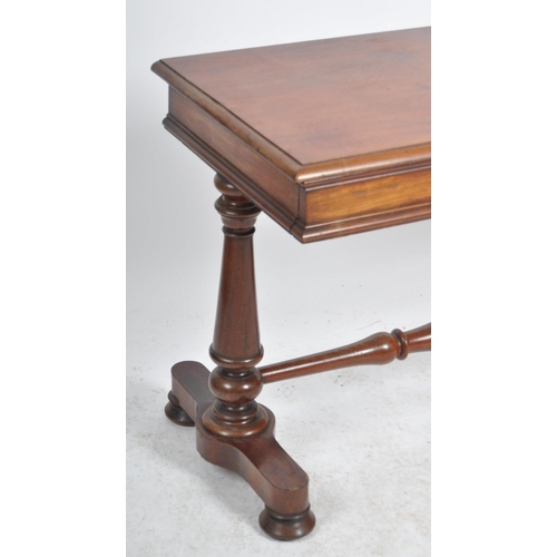 198 - A 19th Century mahogany library writing table desk. Chamfered rectangular table top raised on trestl... 