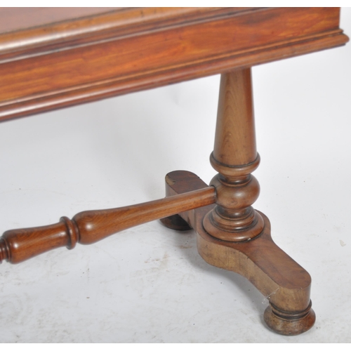 198 - A 19th Century mahogany library writing table desk. Chamfered rectangular table top raised on trestl... 