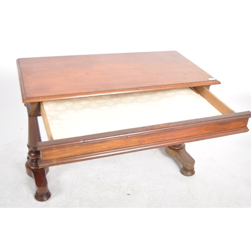 198 - A 19th Century mahogany library writing table desk. Chamfered rectangular table top raised on trestl... 