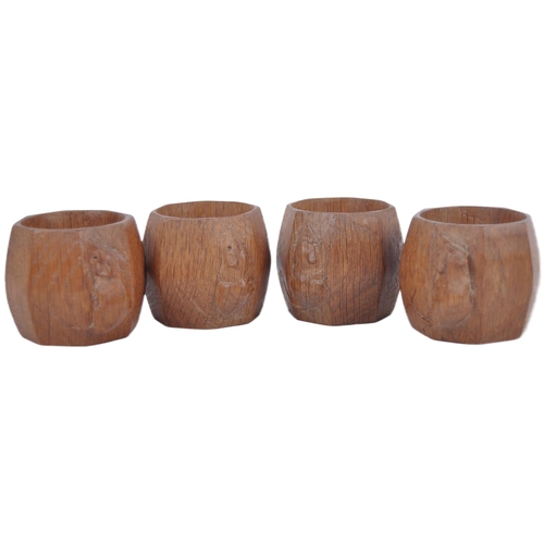 2 - A set of four Robert Mouseman carved oak napkin rings. Each of octagonal form with signature mouse c... 