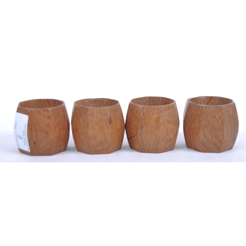 2 - A set of four Robert Mouseman carved oak napkin rings. Each of octagonal form with signature mouse c... 