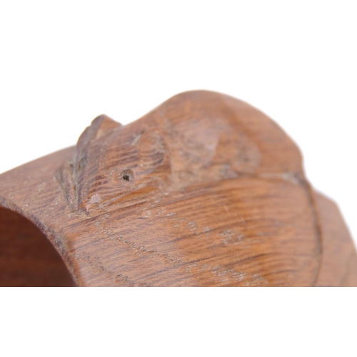 2 - A set of four Robert Mouseman carved oak napkin rings. Each of octagonal form with signature mouse c... 