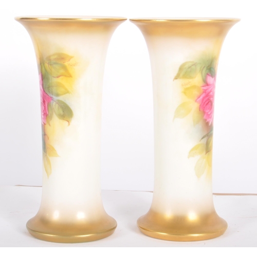 20 - A pair of Royal Worcester hand painted porcelain cabinet vases by Millie Hunt model 923. Tapered tru... 