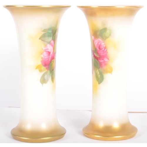 20 - A pair of Royal Worcester hand painted porcelain cabinet vases by Millie Hunt model 923. Tapered tru... 