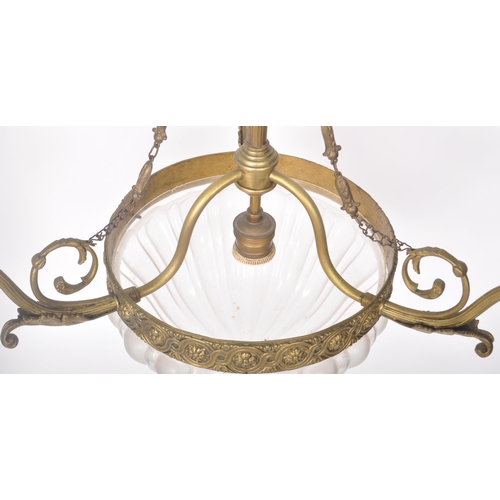 201 - A 20th Century brass hanging three branch chandelier having decorative scrolled arms with frosted gl... 