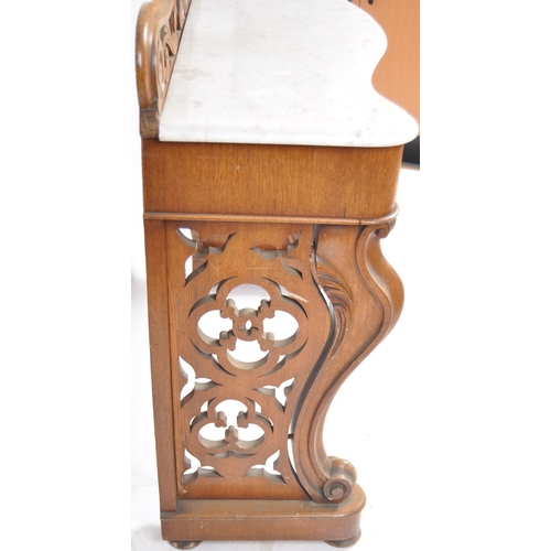 203 - A 19th Century marble topped mahogany console table having a pierced back gallery top with serpentin... 