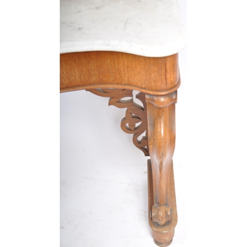 203 - A 19th Century marble topped mahogany console table having a pierced back gallery top with serpentin... 