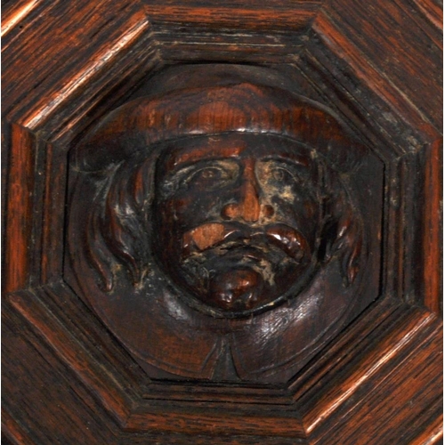 207 - A pair of 19th Century carved oak panel doors of geometric form. Central carved face with intricate ... 