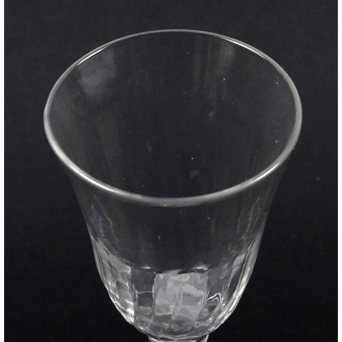 21 - An 18th Century double series opaque twist wine drinking glass having a flute moulded rounded funnel... 