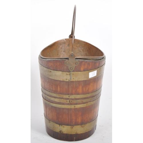 210 - A 19th Century George III Irish mahogany and brass bound peat coal bucket of navette coopered barrel... 