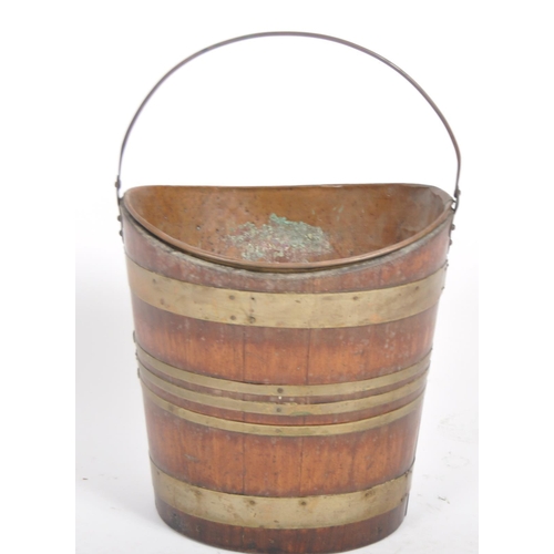 210 - A 19th Century George III Irish mahogany and brass bound peat coal bucket of navette coopered barrel... 