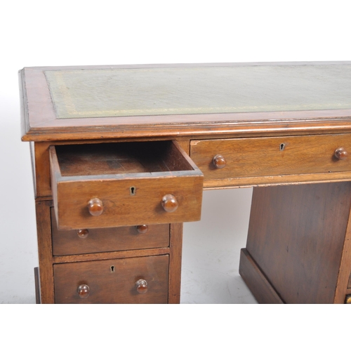 216 - A 19th Century walnut twin pedestal desk of good smaller proportions. Writing table top with sciver ... 