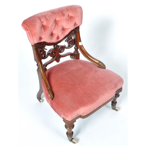 217 - A 19th Century Victorian mahogany nursing chair. The chair having a cushioned buttoned back with fre... 