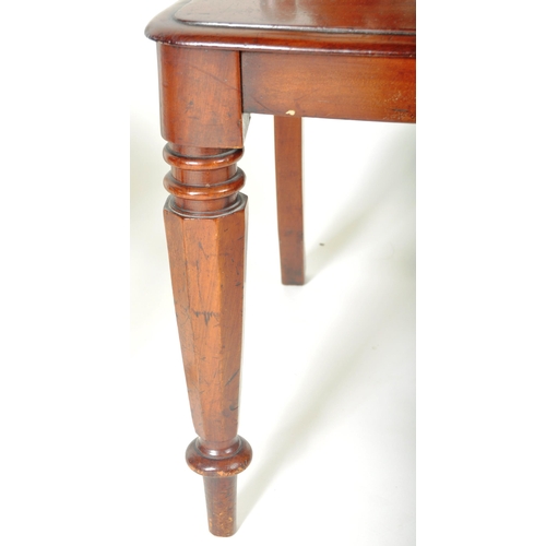 221 - A matching pair of 19th Century Victorian mahogany hall chairs having shaped armorial backrest with ... 