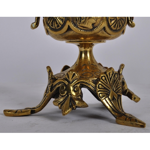 223 - A pair of 19th Century brass twin sconce candelabra having candlestick sconce raised on scrolled arm... 