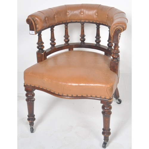 233 - An early 20th Century leather captains desk chair having a buttoned horseshoe backrest with leather ... 