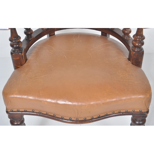 233 - An early 20th Century leather captains desk chair having a buttoned horseshoe backrest with leather ... 