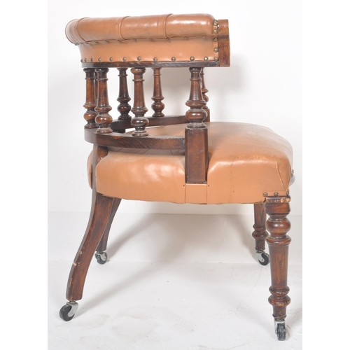 233 - An early 20th Century leather captains desk chair having a buttoned horseshoe backrest with leather ... 