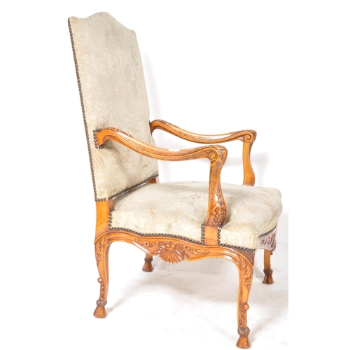 241 - A 19th Century French tapestry fauteuil armchair / throne chair having a padded back and seat rest w... 