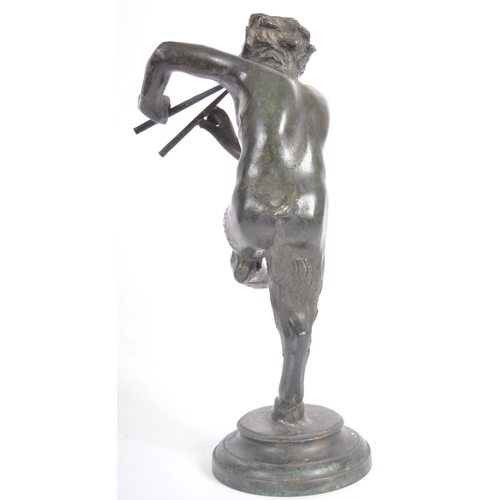 243 - A 19th Century Grand Tour bronze figurine depicting Pan. The satyr form figure having detailed featu... 