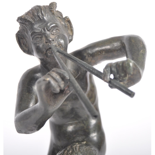 243 - A 19th Century Grand Tour bronze figurine depicting Pan. The satyr form figure having detailed featu... 