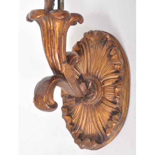 249 - A large 19th Century Victorian giltwood wall light sconce having a four branch arm on scrolled suppo... 