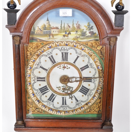 253 - A 19th Century Dutch Friesland hanging wall staart clock / tail clock having a mahogany case with br... 