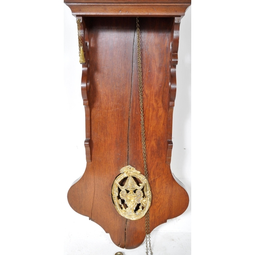 253 - A 19th Century Dutch Friesland hanging wall staart clock / tail clock having a mahogany case with br... 