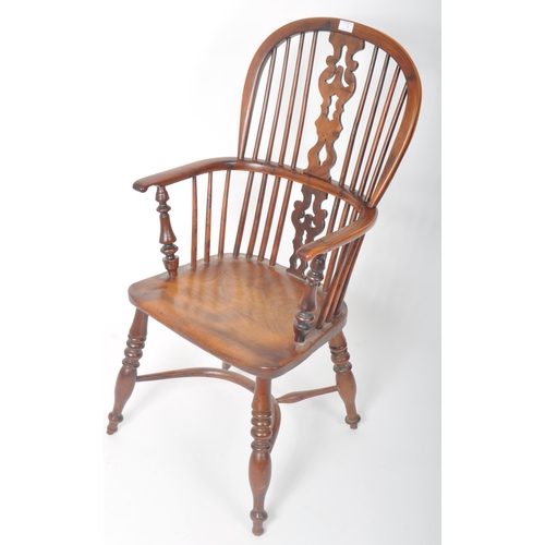 257 - A 19th Century Country Farmhouse Windsor armchair / elbow / fireside chair of yew and elm wood const... 