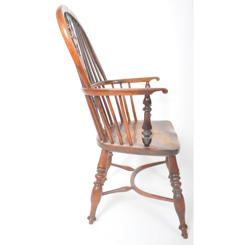 257 - A 19th Century Country Farmhouse Windsor armchair / elbow / fireside chair of yew and elm wood const... 