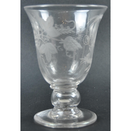 258 - A 19th Century engraved glass coin goblet. The cup bowl decorated with floral motifs, with the monog... 