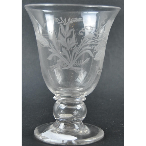 258 - A 19th Century engraved glass coin goblet. The cup bowl decorated with floral motifs, with the monog... 