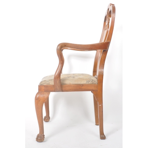 259 - An early 19th Century George III carved walnut carver armchair having a single splatback support wit... 