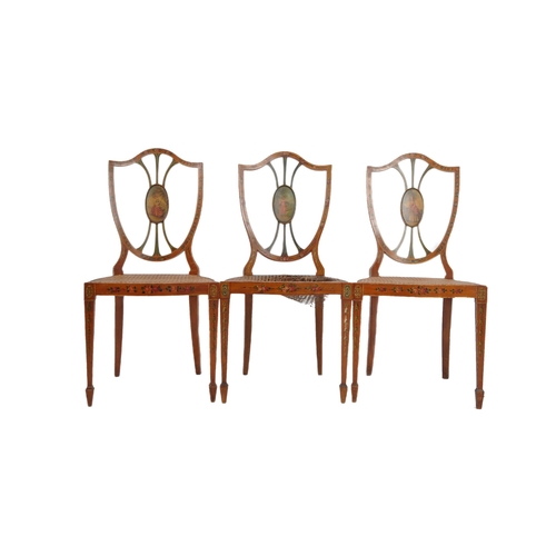 26 - A set of three 19th Century painted faux satinwood shield back dining chairs. Mahogany frames with p... 