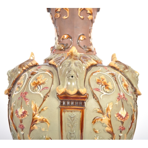 261 - A pair of 19th Century Wilhelm Schiller & Sohn German majolica ewer jugs of large size. Relief mould... 