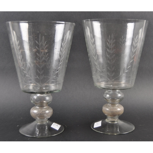 264 - A pair of large mid-Victorian 19th century engraved glass vase, the vase has a bell form bowl raised... 