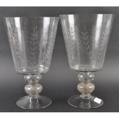 264 - A pair of large mid-Victorian 19th century engraved glass vase, the vase has a bell form bowl raised... 