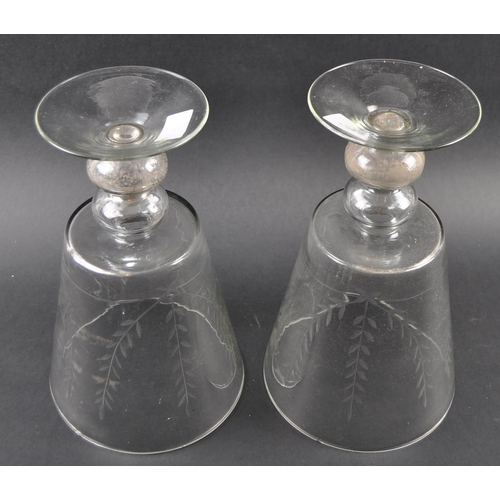 264 - A pair of large mid-Victorian 19th century engraved glass vase, the vase has a bell form bowl raised... 