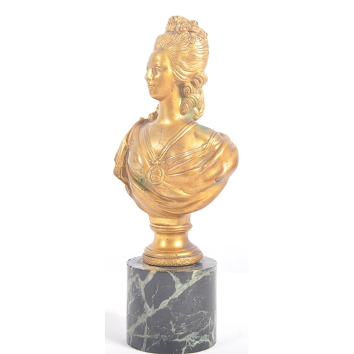 266 - An early 20th century gilded bronze bust sculpture of Marie Antoinette, raised on a cylindrical marb... 