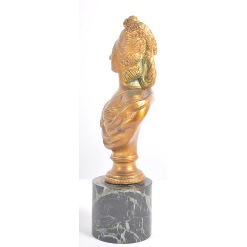 266 - An early 20th century gilded bronze bust sculpture of Marie Antoinette, raised on a cylindrical marb... 