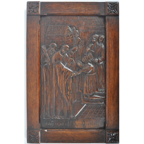 272 - A carved oak plaque depicting Henry II at the Tomb of Thomas Becket. The panel of rectangular form h... 