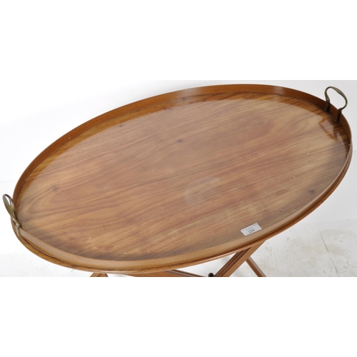 275 - A 19th Century Victorian mahogany butlers tray / serving tray on stand. The tray of a oval form with... 