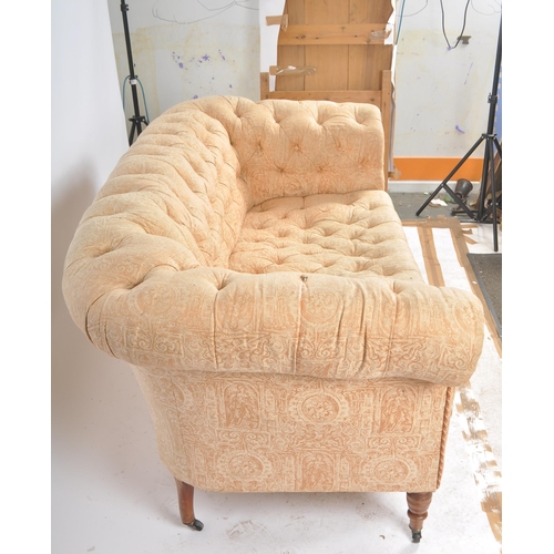 276 - A 19th Century Victorian two seater sofa settee having Chesterfield style scrolled button backed bac... 